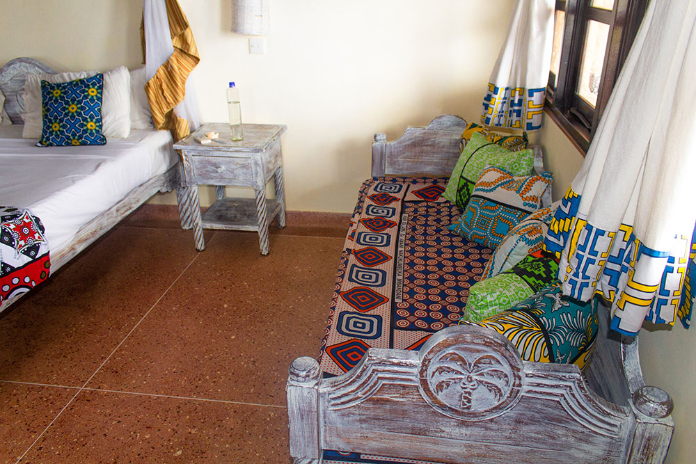 Swahili bed inside the standard room at Chale Island